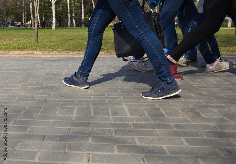 Fototapeta premium walking on city streets with shoes and athletic shoes