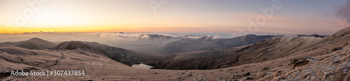 Sunrise on frozen mountains of Snowdonia National Park, Wales, UK