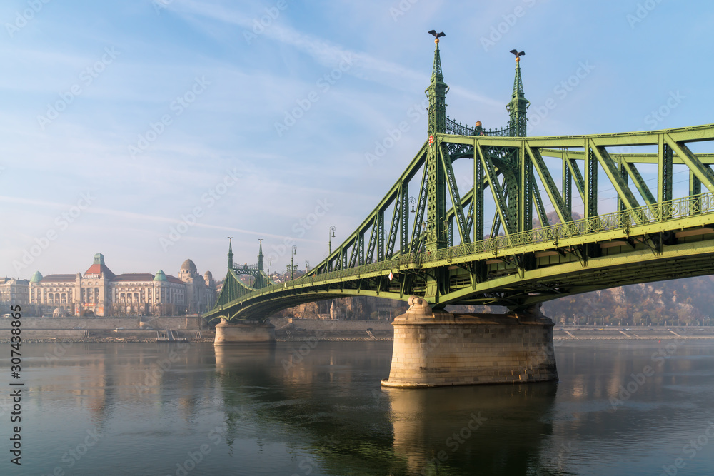 Fototapeta premium The Liberty Bridge in Budapest in Hungary, it connects Buda and Pest cities across the Danube river. shortest bridge in Budapest city.