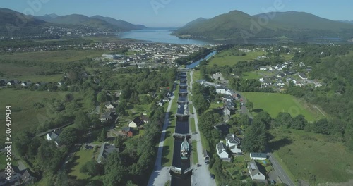 Wide aerial travelling down the Neptune's Staircase series of locks on the Caledonian Canal in Banavie towards Loch Eil, Fort William, Scotland photo