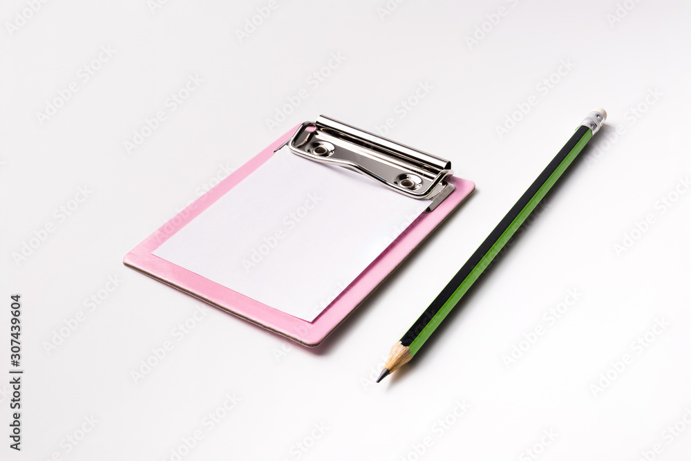 little pink paper clipboard. short note to paper with pencil. office equipment. blank paper clipboard for task checklist. holding clipboard in hand for writing survey little pink paper clipboard. short note to paper with pencil. office equipment. blank paper clipboard for task checklist. holding clipboard in hand for writing survey