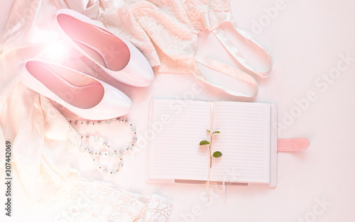 Wedding flat lay, womans stylish accessories in pink colors on white background bokeh lights,copy space.Valentines card, bridal concept,notebook mockup, fashion dress,shoes,trendy composition,top view