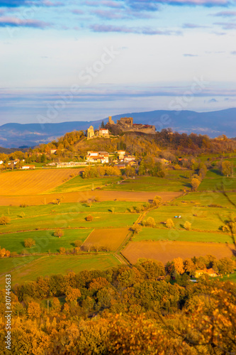 French rural landscape with a castle on a hill in a distance. (ID: 307445633)
