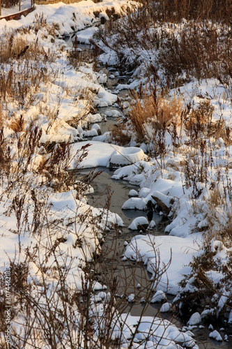 the river is covered with snow and ice, winter is coming. winter landscape. layout background