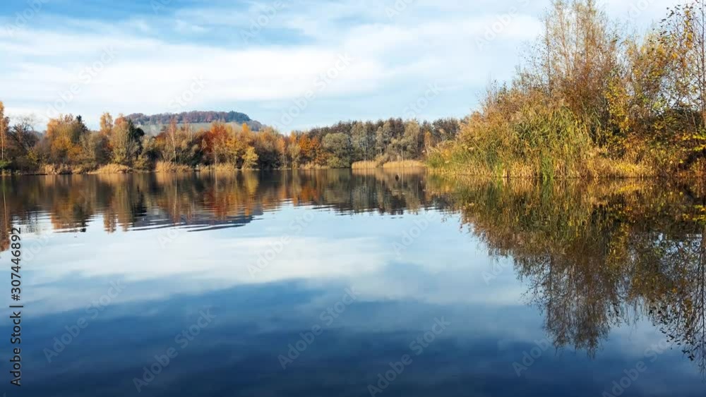 Panoramic view of the bird lake in the nature reserve Haff Reimech. Ornithology center Biodiversum in Remerschen near Schengen, Luxembourg. Nature protection concept. Panoramic view of the bird lake in the nature reserve Haff Reimech. Ornithology center Biodiversum in Remerschen near Schengen, Luxembourg. Nature protection concept.