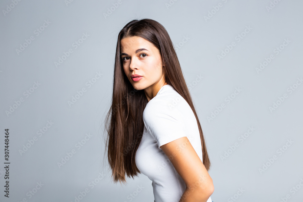 Young woman touching and play with her hair isolated on white background Young woman touching and play with her hair isolated on white background