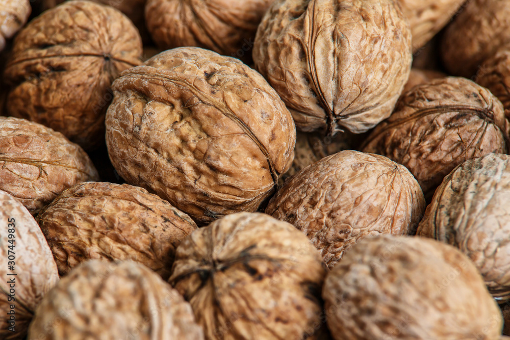 walnuts, unpeeled greek nuts, harvest of walnuts, walnuts closeup, background with walnuts,organic delicious nuts. healthy snack. walnuts, unpeeled greek nuts, harvest of walnuts, walnuts closeup, background with walnuts,organic delicious nuts. healthy snack.