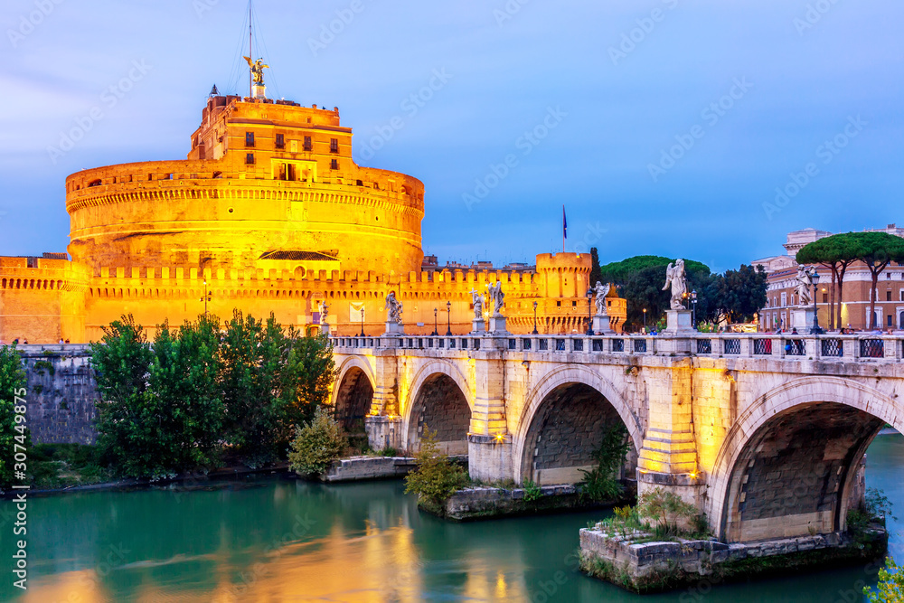 Castel Sant'Angelo and the Sant'Angelo bridge during twilight sunset in Rome, Italy