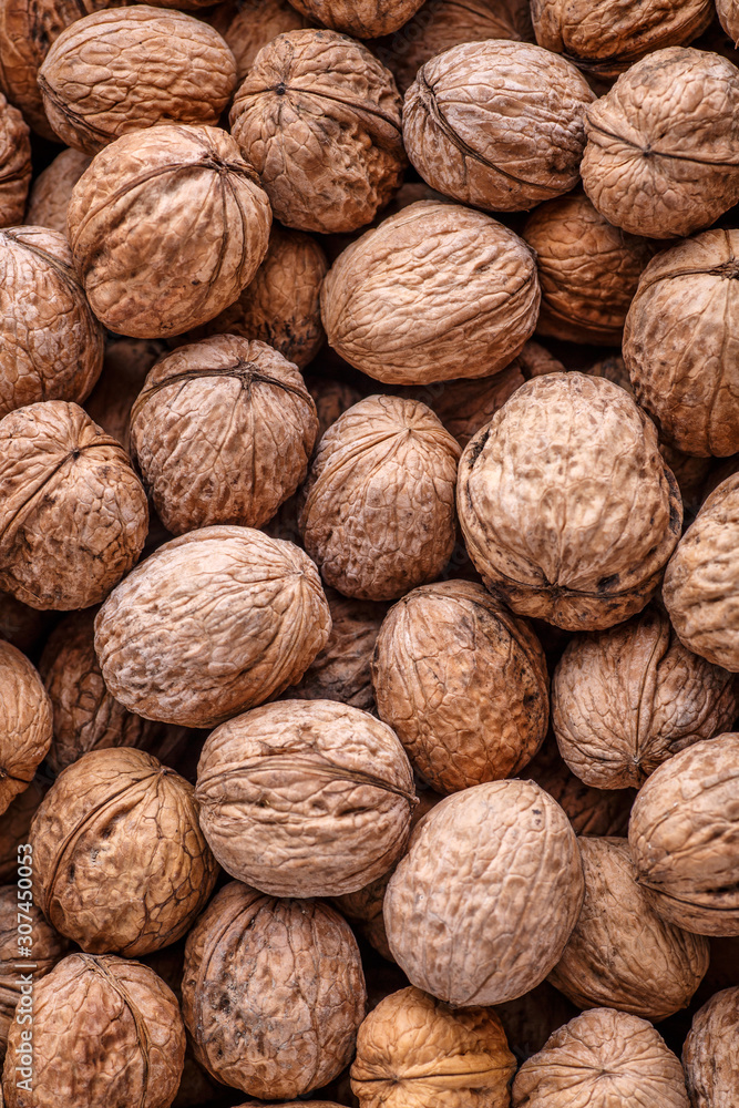 walnuts, unpeeled greek nuts, harvest of walnuts, walnuts closeup, background with walnuts,organic delicious nuts. healthy snack. walnuts, unpeeled greek nuts, harvest of walnuts, walnuts closeup, background with walnuts,organic delicious nuts. healthy snack.
