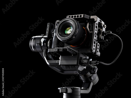 Professional digital camera on black background