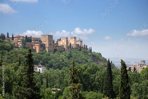 View to Alhambra form Sacromonte village famous for its houses made in caves at the hill slopes, Granada, Spain