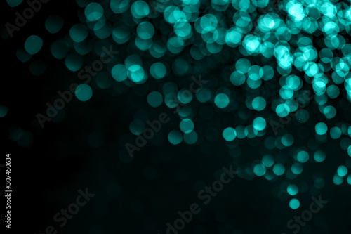 Bright mint glitter raster festive background. Abstract shimmering circles decorative backdrop. Bokeh lights with shiny effect illustration. Overlapping glowing and twinkling spots. © Mirror Flow