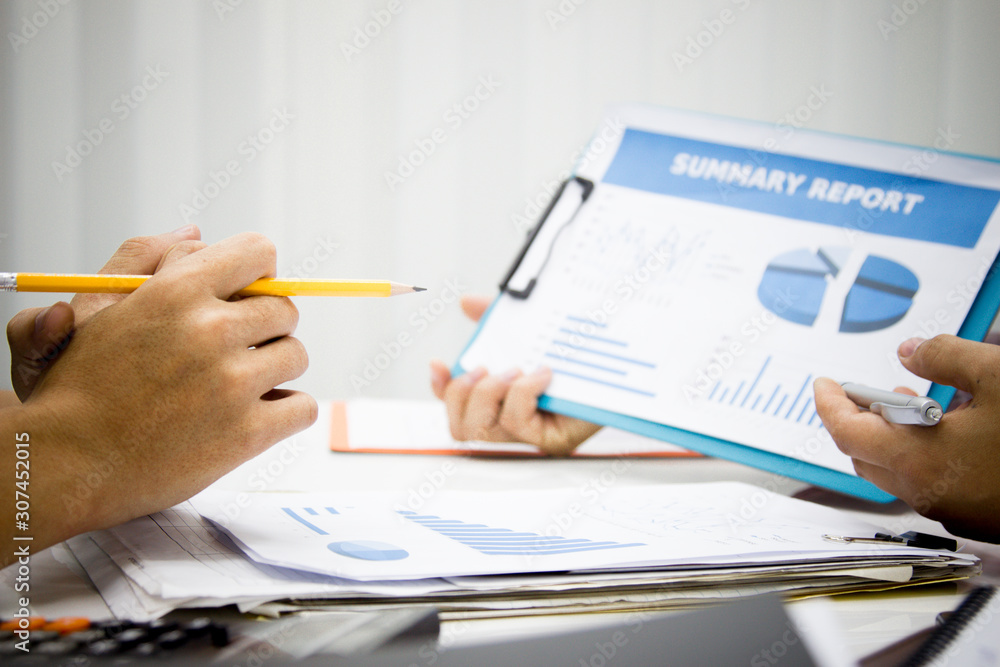 businessman working use present for Economic outlook in office for discussing documents and ideas , with soft focus, vintage tone businessman working use present for Economic outlook in office for discussing documents and ideas , with soft focus, vintage tone