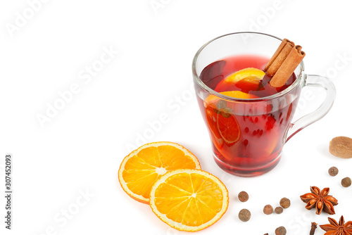 Mulled wine with orange, cinnamon sticks, anise isolated on white background. Free space for text.