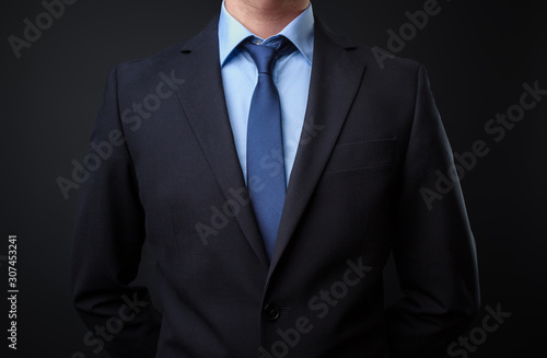 Man in black blue suit with tie