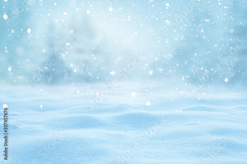 Winter background with snow and blurred bokeh.Merry Christmas and happy New Year greeting card with copy-space.