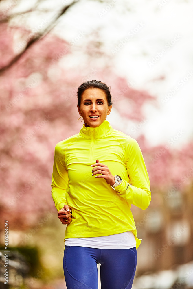 Close up of a woman running in the spring. Close up of a woman running in the spring.