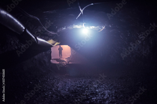Miner walking inside a quartzo mine photo