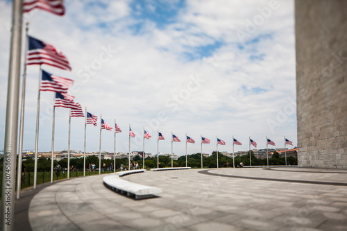 Tilt shift view of flags beneath the Washington Monument in DC. photo