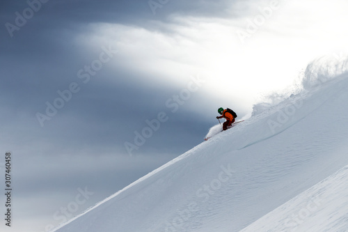 Man off-piste skiing photo