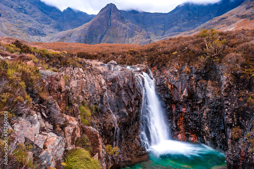 Fairy Pools waterfall in the Isle of Skye  Scotland next to Glen brittle mountain in the Scottish Highlands. Natural magical place with vivid colors and crystal clear blue pools on the river.