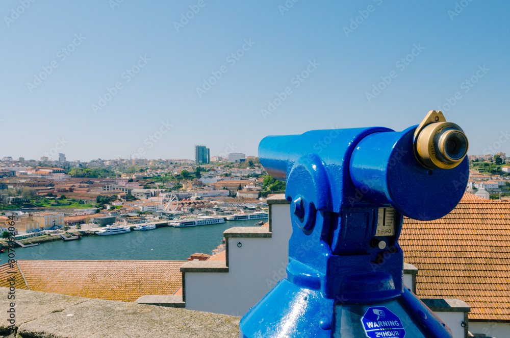 Blue field-glass pointing the Douro River in Porto
