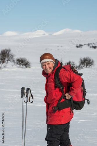 Senior woman cross country skiing