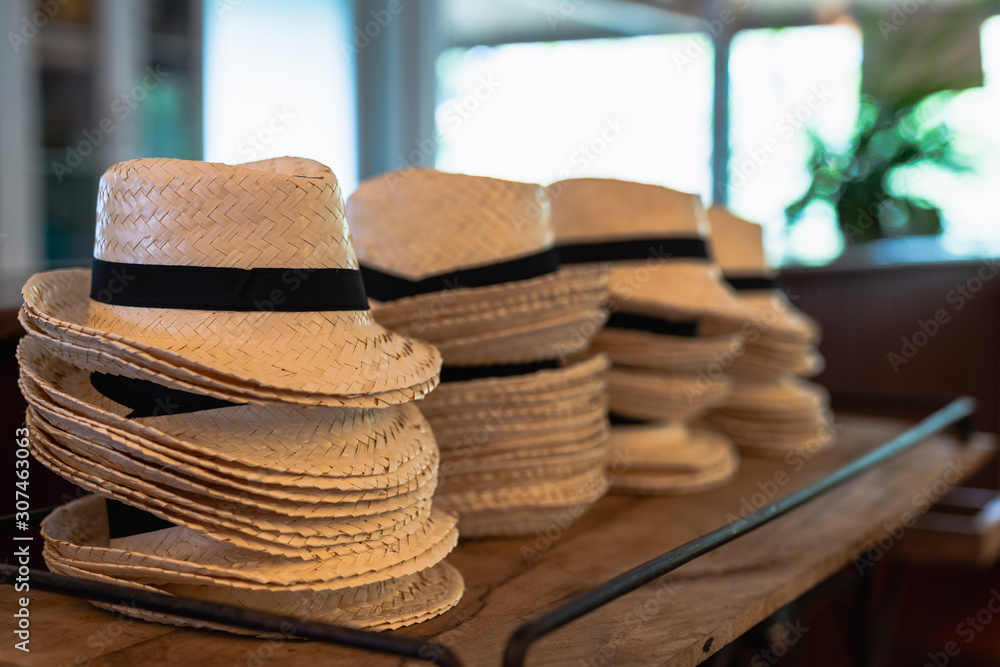 stack of straw hats as souvenir gift