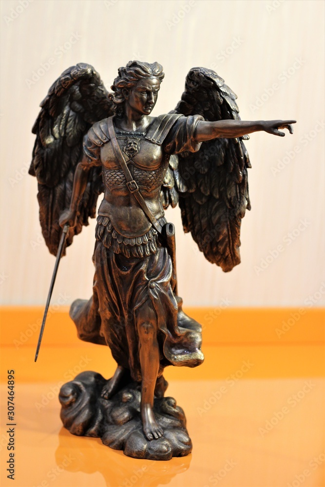 bronze sculpture of Archangel Michael with wings and sword Stock Photo ...