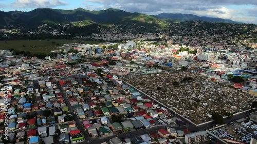 Aerial view of city Port of Spain in Trinidad, background of civil and government buildings, cemetery. Beautiful mountain and sky. Capital of Trinidad and Tobago