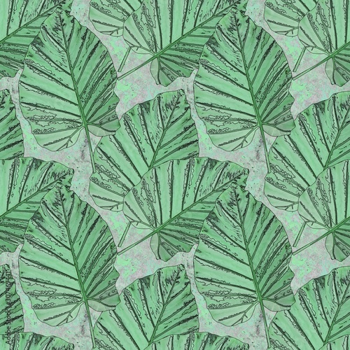 Seamless abstract pattern. Green tropical leaves on a gray stone background with green splashes.