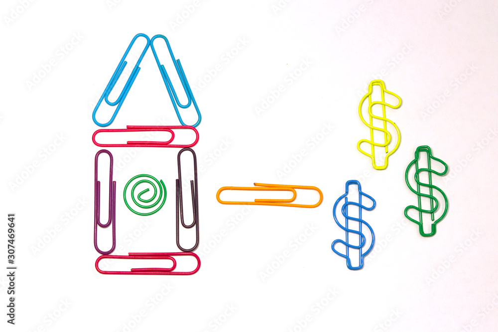 A house of colored paper clips and three dollar signs. colorful paper clips of different shapes. Mortgage or profitable investment in a new home for the family. The view from the top