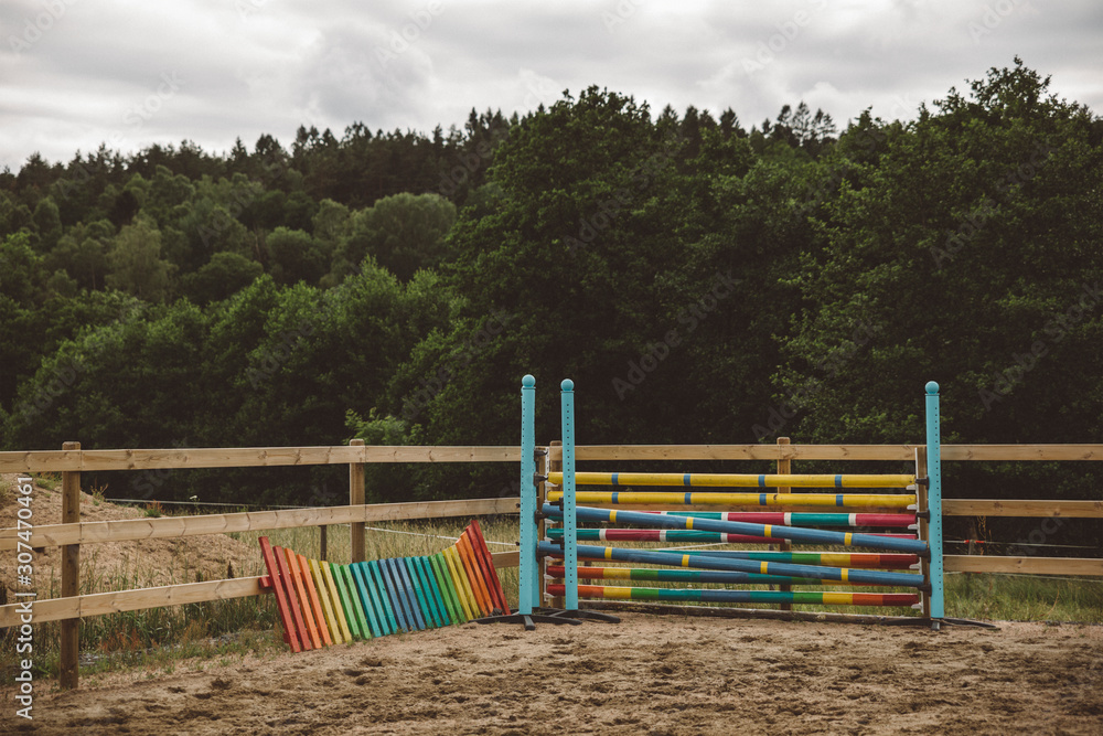 Colorful hurdles on paddock Colorful hurdles on paddock