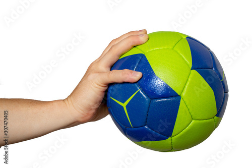 Handball ball in hand closeup on a white background
