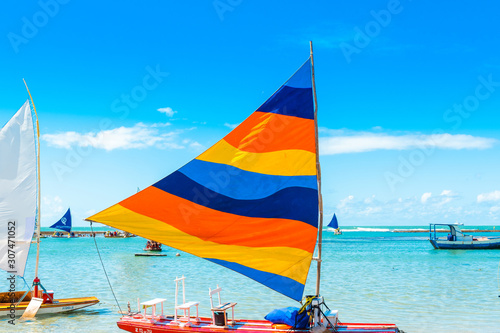Sailing boat on the beach of Porto de Galinhas in Ipohuca Municipality, Pernambuco, Brazil. photo