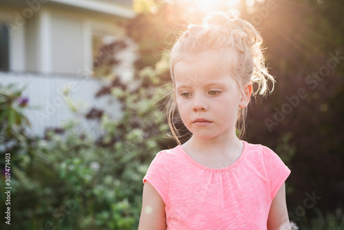 Little shy blonde girl photo