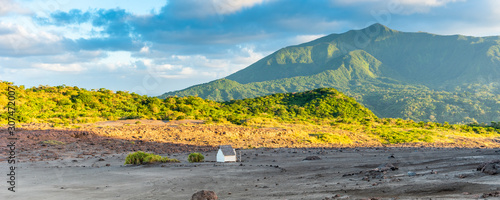 Hut on the background of a mountain landscape, Tanna Island, Vanuatu. photo