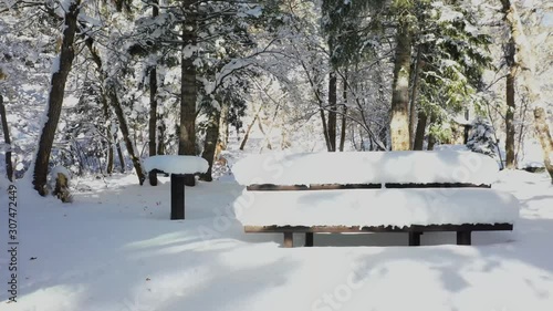 Wallpaper Mural picnic bench and table near river covered in fresh fluffy snow Torontodigital.ca