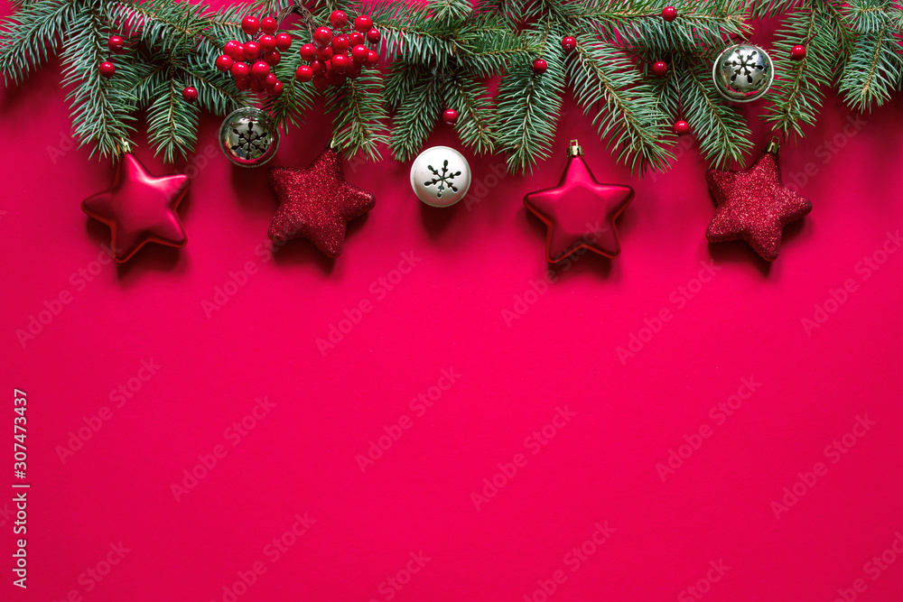 Christmas winter background, Christmas card. Fir branches and holiday decorations on a pink background, top view with space for text. Christmas winter background, Christmas card. Fir branches and holiday decorations on a pink background, top view with space for text.