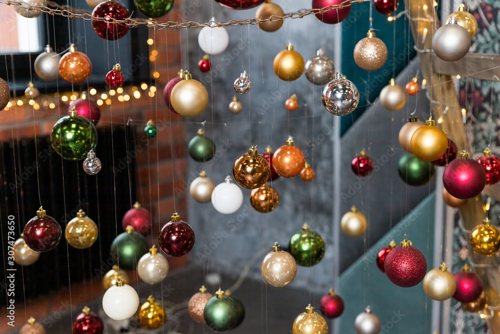 Creative festive composition with string on blurred background.Winter concept. Christmas tree decorations, colorful balls.Christmas baubles.Cafe, Restaurant,Street decorations.Happy new year Creative festive composition with string on blurred background.Winter concept. Christmas tree decorations, colorful balls.Christmas baubles.Cafe, Restaurant,Street decorations.Happy new year