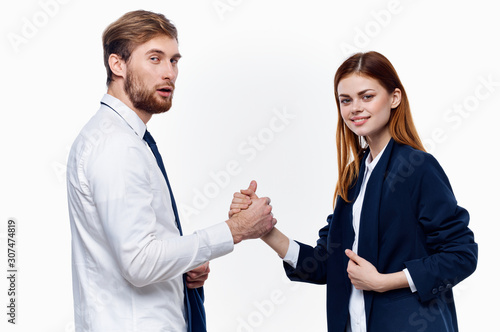 business man and woman shaking hands isolated on white