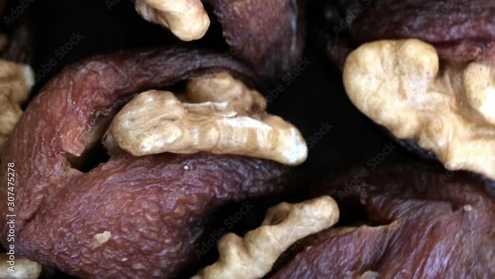 Grocery video screensaver, rotating background of dried apricots stuffed with walnut kernels using zoom and move the camera Grocery video screensaver, rotating background of dried apricots stuffed with walnut kernels using zoom and move the camera
