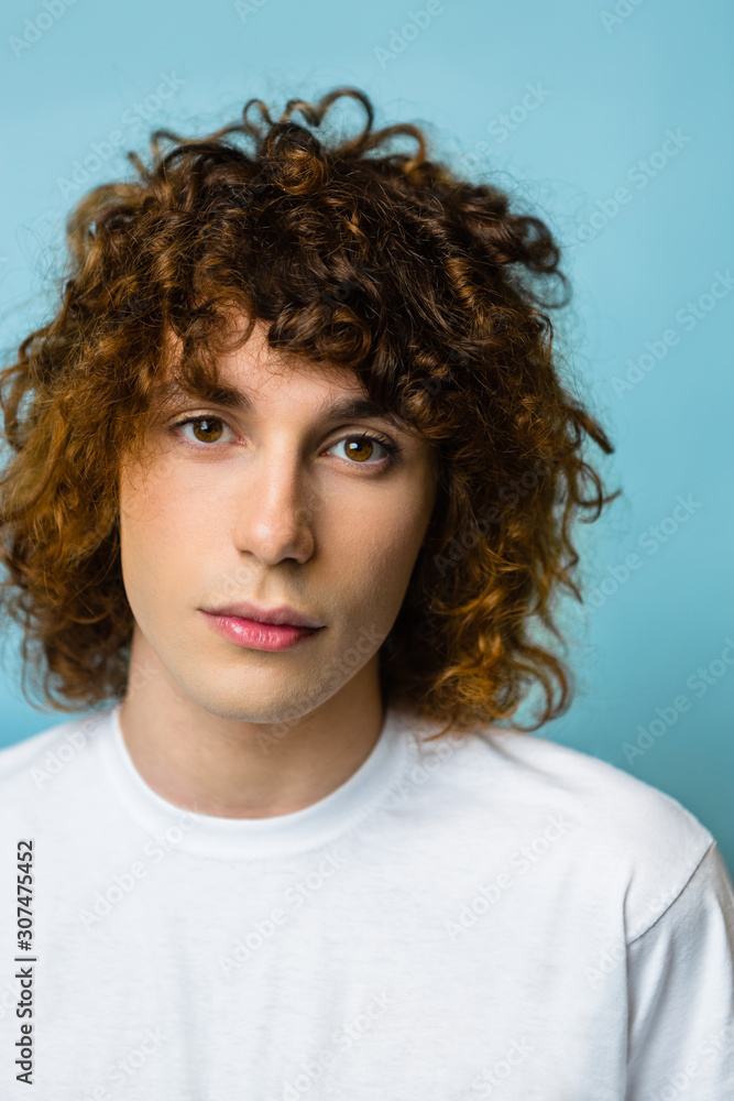 Portrait of young man standing indoors Portrait of young man standing indoors