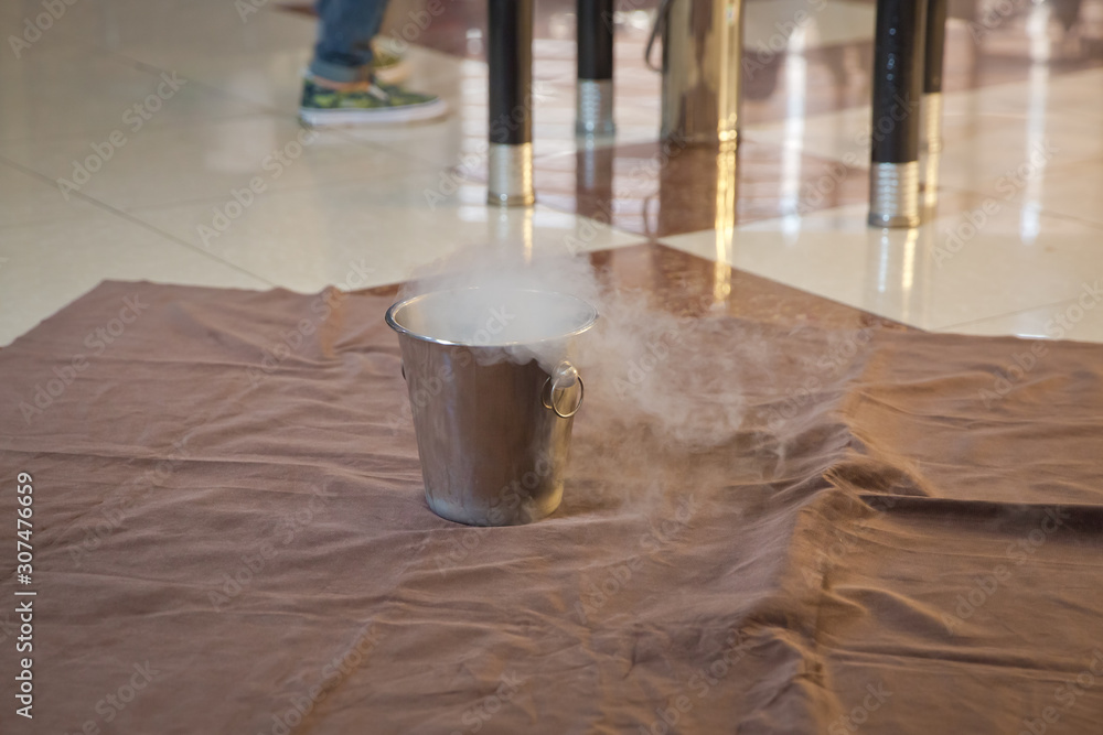 Chemical experiment, show with liquid nitrogen . Steam of Nitrogen Created from Liquid Nitrogen Exposed to Temperatures . Chemical experiment, show with liquid nitrogen . Steam of Nitrogen Created from Liquid Nitrogen Exposed to Temperatures .