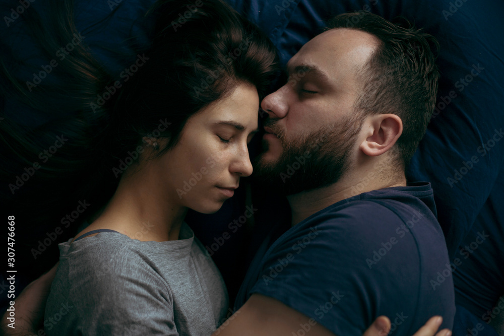 Close up of couple sleeping on bed Close up of couple sleeping on bed