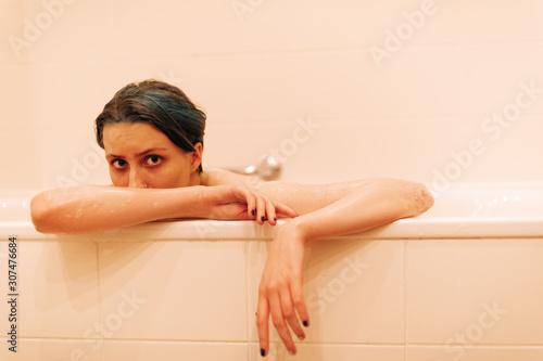 Young Androgyne Woman In Bath