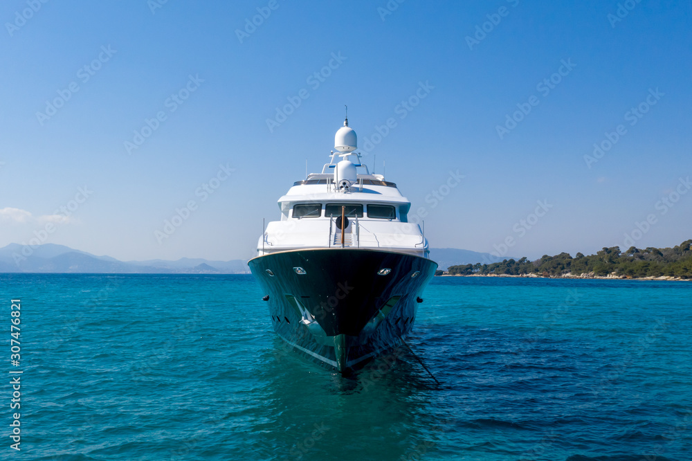 Sailing in Style: Front View of Expensive Charter Yacht on Turquoise Mediterranean Sea