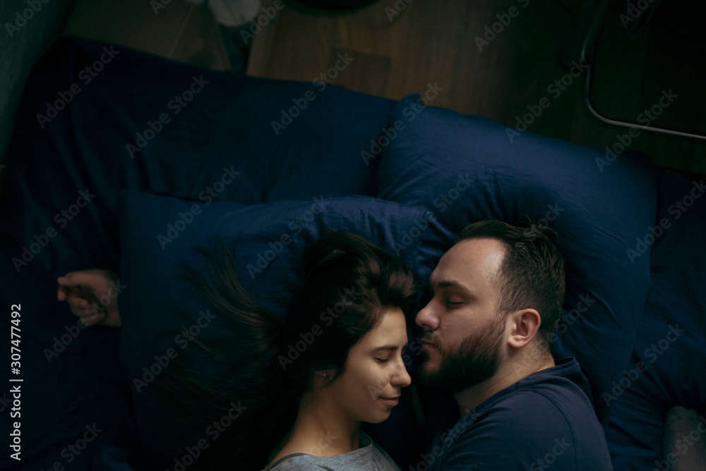 portrait of sleeping husband and wife lie on the pillow portrait of sleeping husband and wife lie on the pillow
