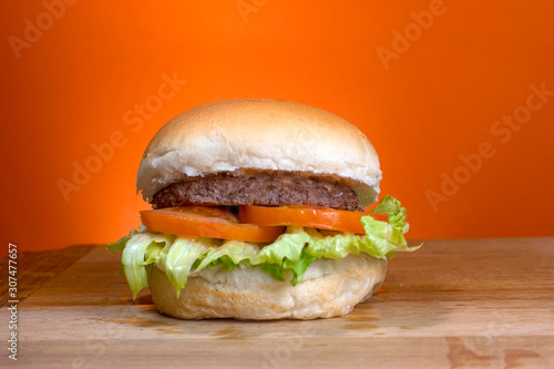 Take-Away foods on Orange vibrant background colour and wood