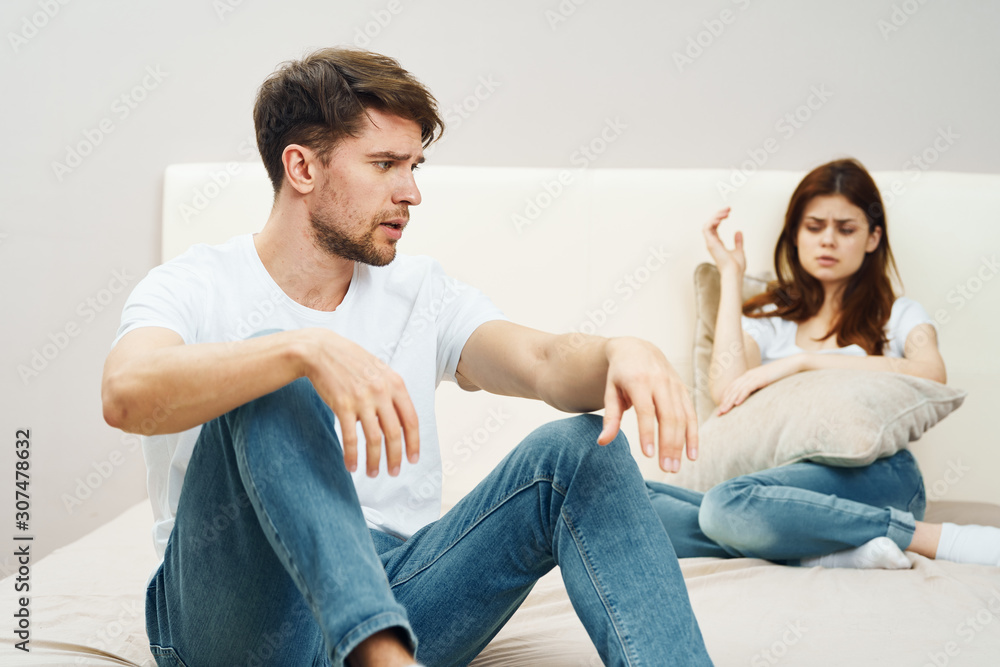 couple sitting on sofa and watching tv couple sitting on sofa and watching tv